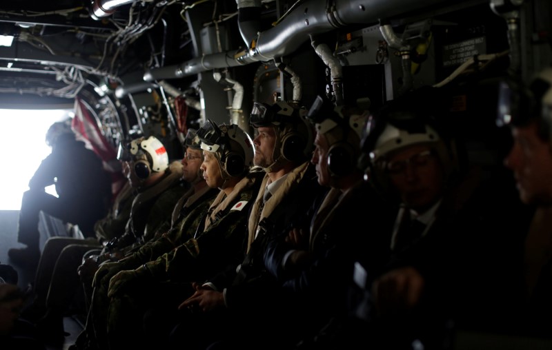 Journalists and officials fly aboard a U.S. Marines MV-22 Osprey Aircraft from the deck of the USS Bonhomme Richard amphibious assault ship off the coast of Sydney, Australia on June 29, 2017. (REUTERS/Jason Reed)