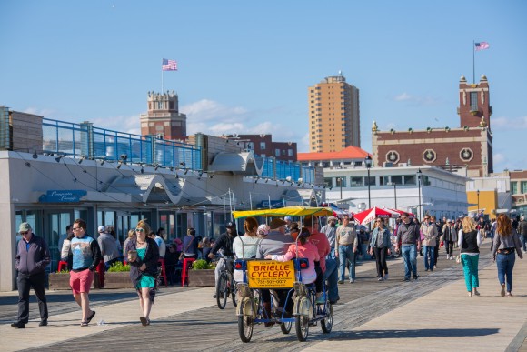 People strolling along the boardwalk. (Asbury Park Boardwalk)