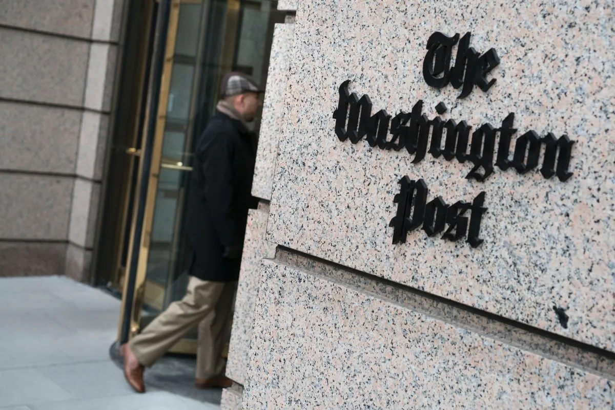 A man walks into the Washington Post's building on March 3, 2016 in Washington, DC. (BRENDAN SMIALOWSKI/AFP/Getty Images)