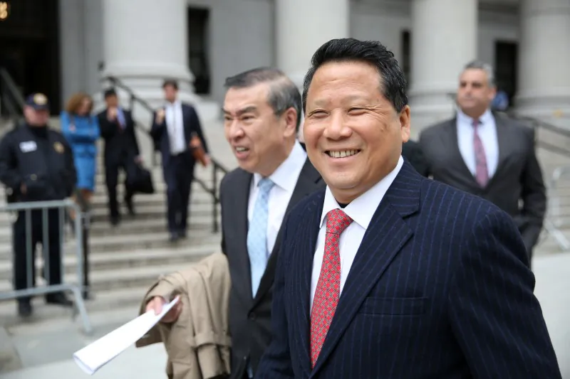 Macau billionaire real estate developer Ng Lap Seng (R), accused of bribing former United Nations General Assembly president John Ashe, exits the Manhattan U.S. District Courthouse in New York, U.S. April 7, 2017. (REUTERS/Ashlee Espinal)