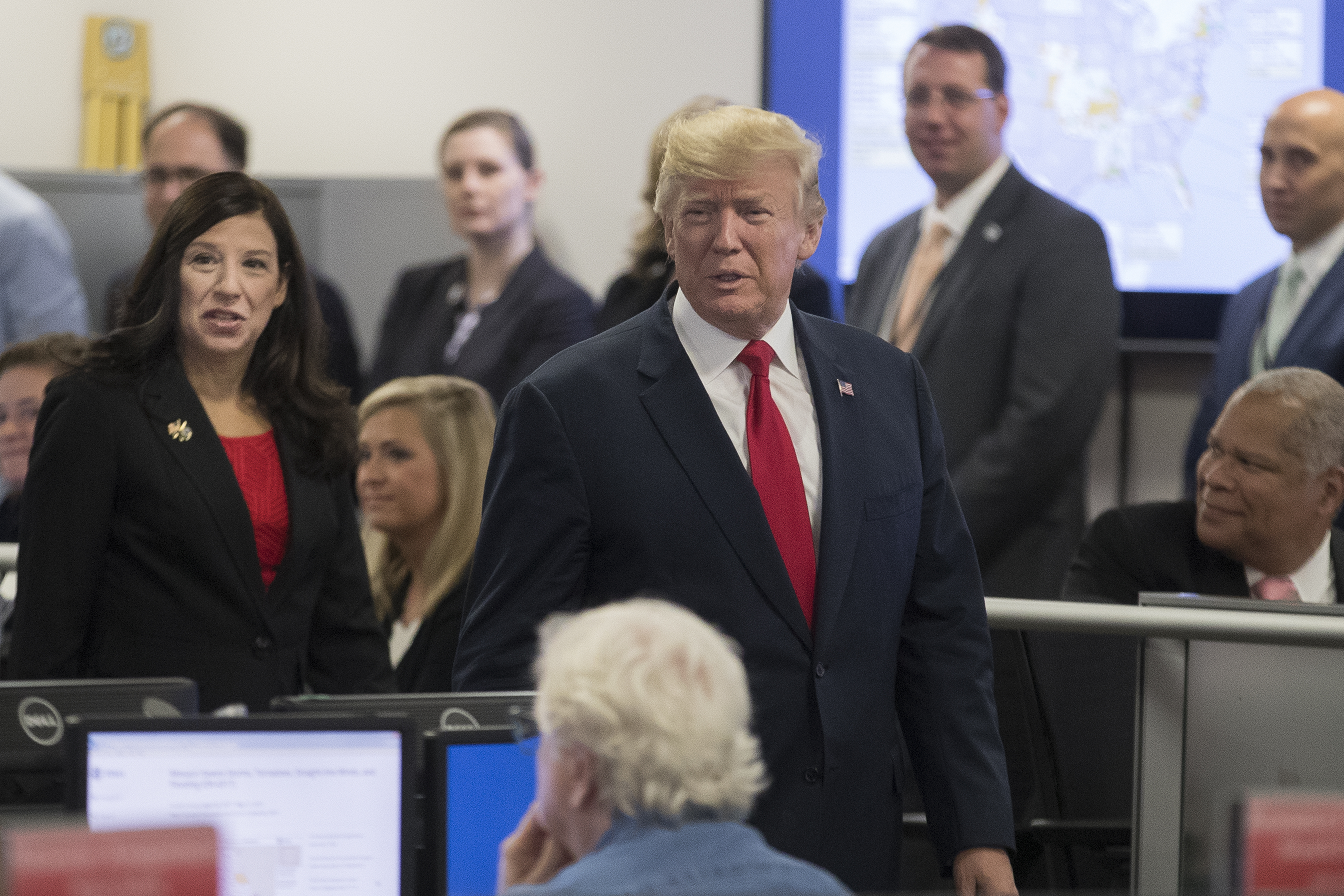 President Donald Trump visits the command center of the Federal Emergency Management Agency (FEMA) headquarters, beside Acting Director of the Department of Homeland Security Elaine Duke (L), in Washington on Aug. 4, 2017. (Michael Reynolds - Pool/Getty Images)