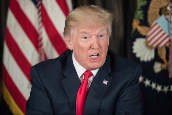 US President Donald Trump speaks about North Korea at a meeting with administration officials on the opioid addiction crisis at the Trump National Golf Club in Bedminster, New Jersey, on August 8, 2017. (NICHOLAS KAMM/AFP/Getty Images)
