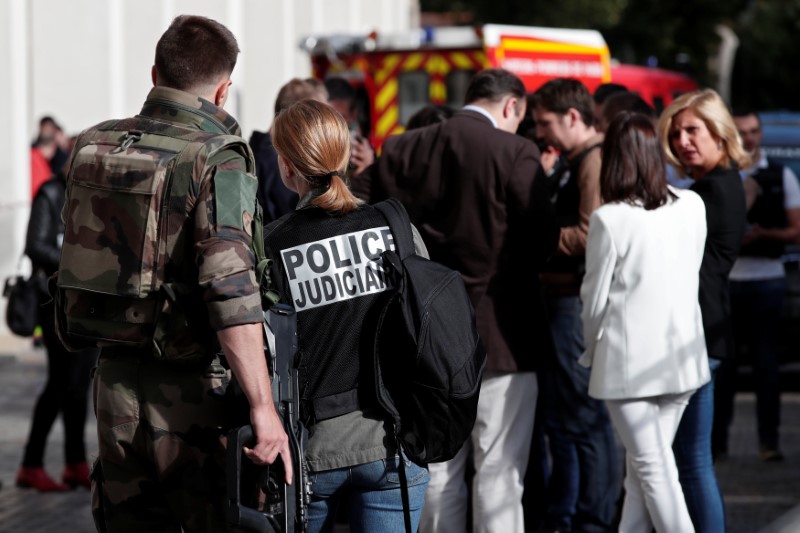 Police work near the scene where French soliders were hit and injured by a vehicle in the western Paris suburb of Levallois-Perret, France, August 9, 2017.     REUTERS/Benoit Tessier