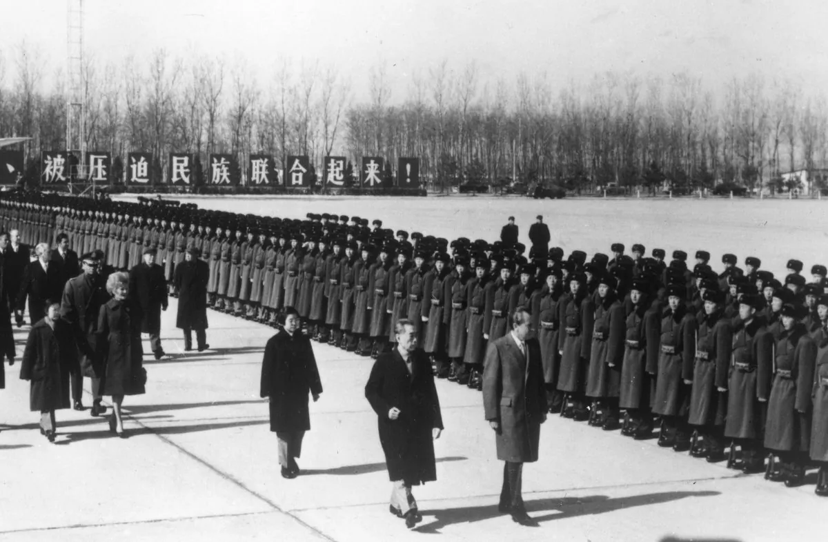 President Richard Nixon and Chinese Prime Minister Zhou Enlai inspect the honor guard at the Beijing Capital Airport in China on Feb. 22, 1972. (Keystone/Getty Images)