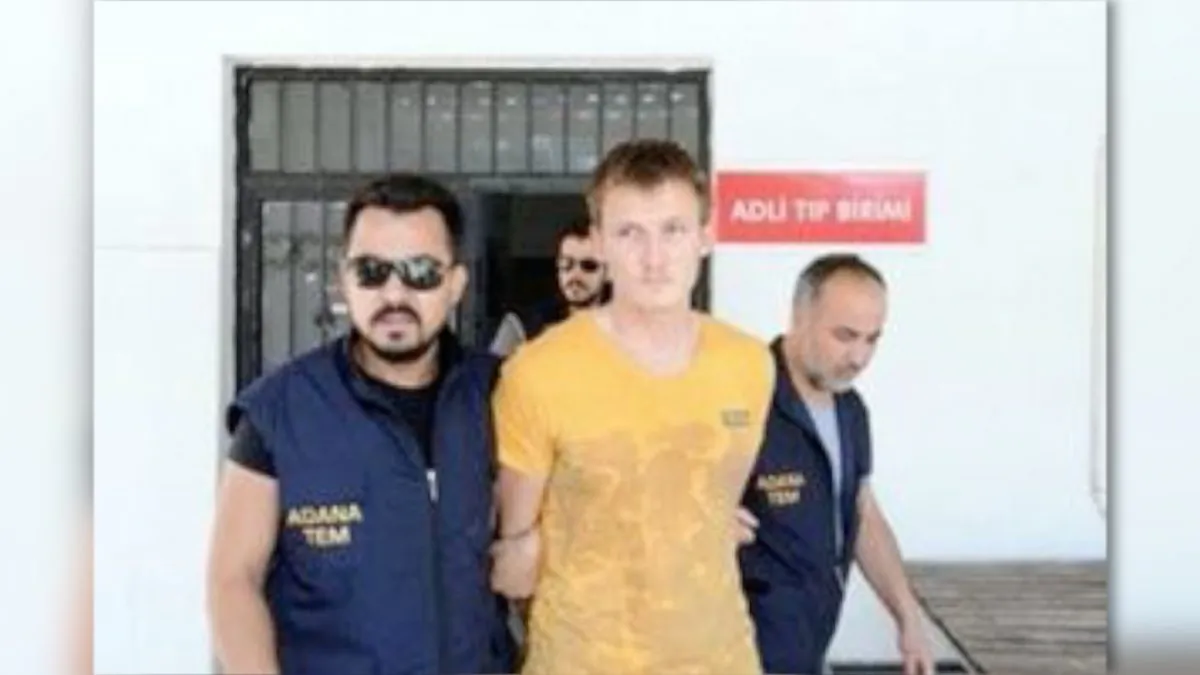 Russian national Renat Bakiev, a suspected Islamic State militant who allegedly planned to use a drone to bring down a U.S. plane at the Incirlik air base, is escorted by police officers as he arrives to a hospital for a medical check in the city of Adana, Turkey, August 10, 2017. (Dogan News Agency via REUTERS)