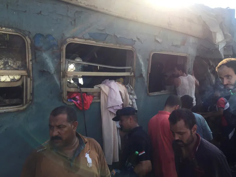 Egyptians search for survivors at the site of a crash where two trains collided near the Khorshid station in Egypt's coastal city of Alexandria, Egypt on Aug. 11, 2017. (REUTERS/Osama Nageb)