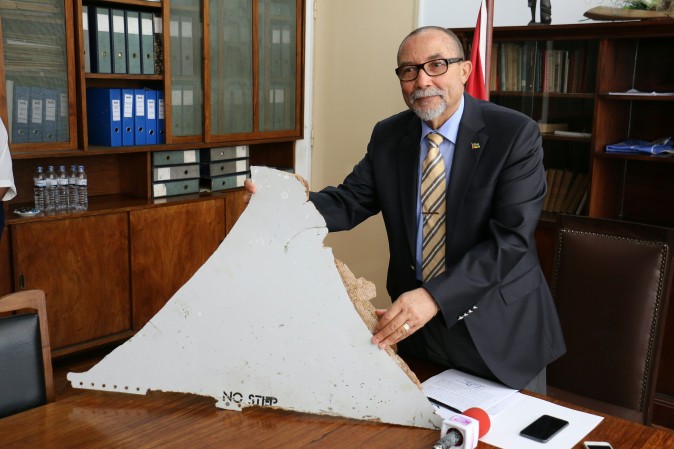 Joao de Abreu, President of Mozambique's Civil Aviation Institute (IACM), holds a piece of suspected aircraft wreckage of the Flight 370 found off the east African coast of Mozambique at Mozambique's Civil Aviation Institute (IACM) in Maputo on March 3, 2016. (ADRIEN BARBIER/AFP/Getty Images)