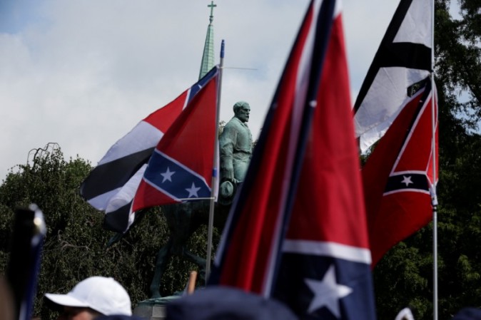 Members of white nationalists rally around a statue of Robert E. Lee in Charlottesville, Virginia, U.S., August 12, 2017.   REUTERS/Joshua Roberts