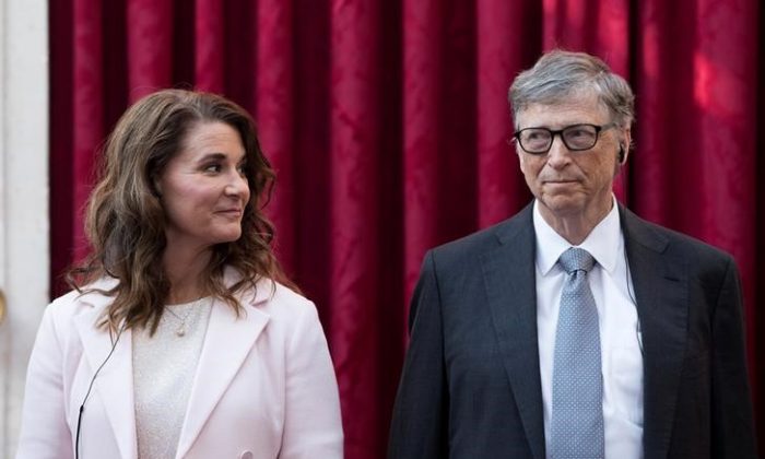 Philanthropist and co-founder of Microsoft, Bill Gates (R) and his wife Melinda listen to the speech by French President Francois Hollande, prior to being awarded Commanders of the Legion of Honor at the Elysee Palace in Paris, France, on April 21, 2017. (Kamil Zihnioglu/Reuters)