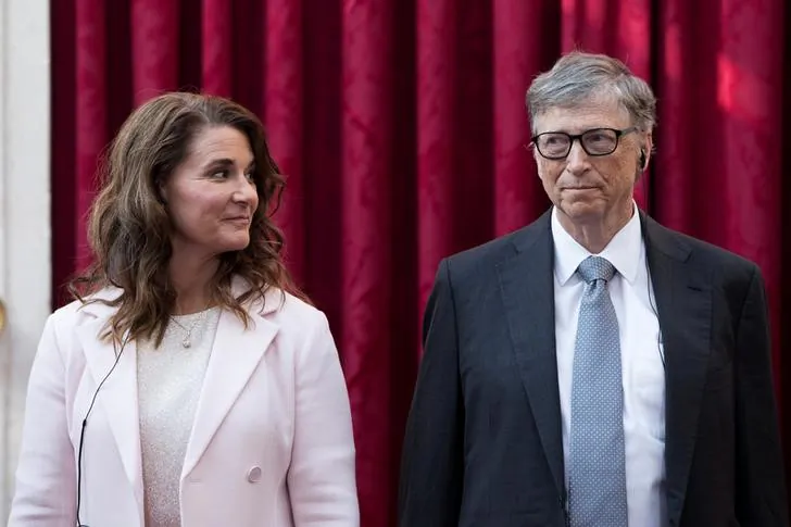 Philanthropist and co-founder of Microsoft, Bill Gates (R) and his wife Melinda listen to the speech by French President Francois Hollande, prior to being awarded Commanders of the Legion of Honor at the Elysee Palace in Paris, France, on April 21, 2017. (Kamil Zihnioglu/Reuters)