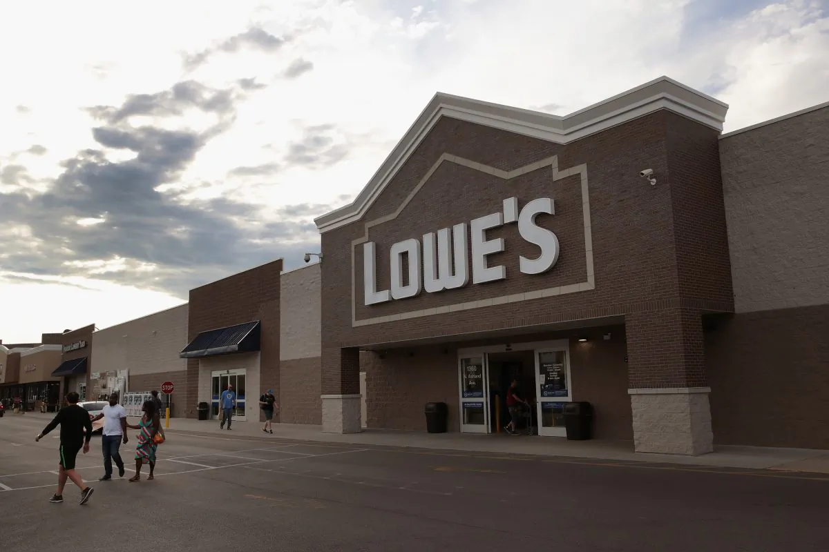 Customers shop at a Lowe's home improvement store on July 25, 2017 in Chicago, Illinois. A shortage of new single-family homes in the U.S. is causing many home owners to renovate their existing homes rather than move, which is driving up earnings and stock prices for home improvement retailers.  (Photo by Scott Olson/Getty Images)