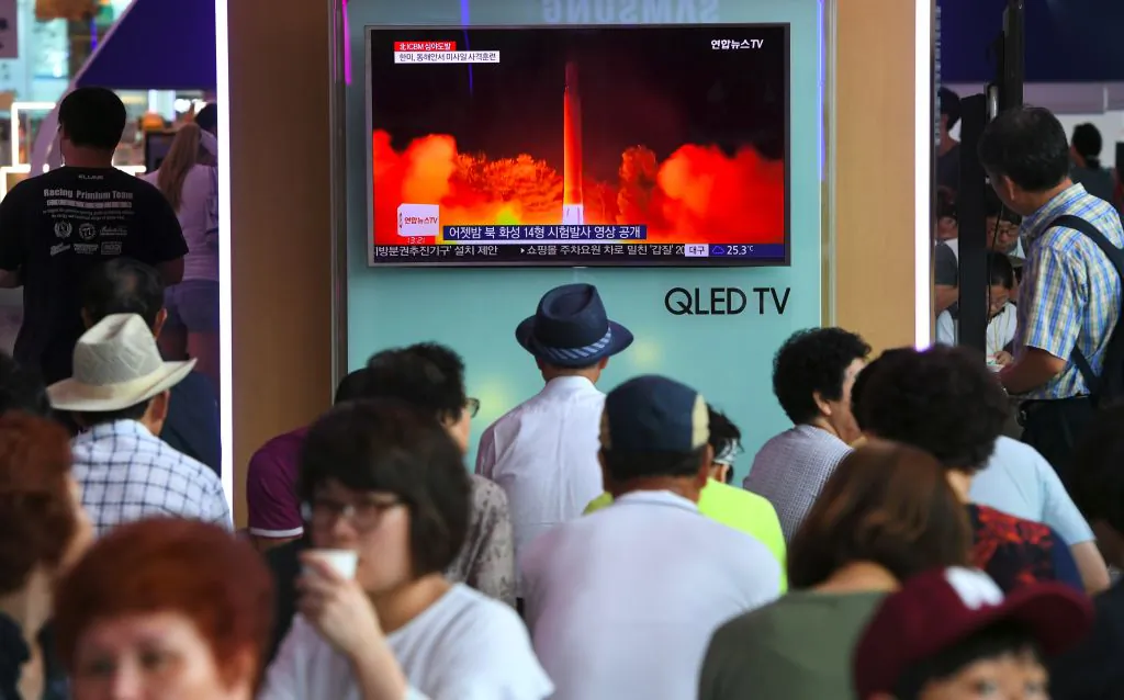 People watch a television screen showing a video footage of North Korea's latest test launch of an intercontinental ballistic missile (ICBM), at a railway station in Seoul on July 29, 2017.
(JUNG YEON-JE/AFP/Getty Images)