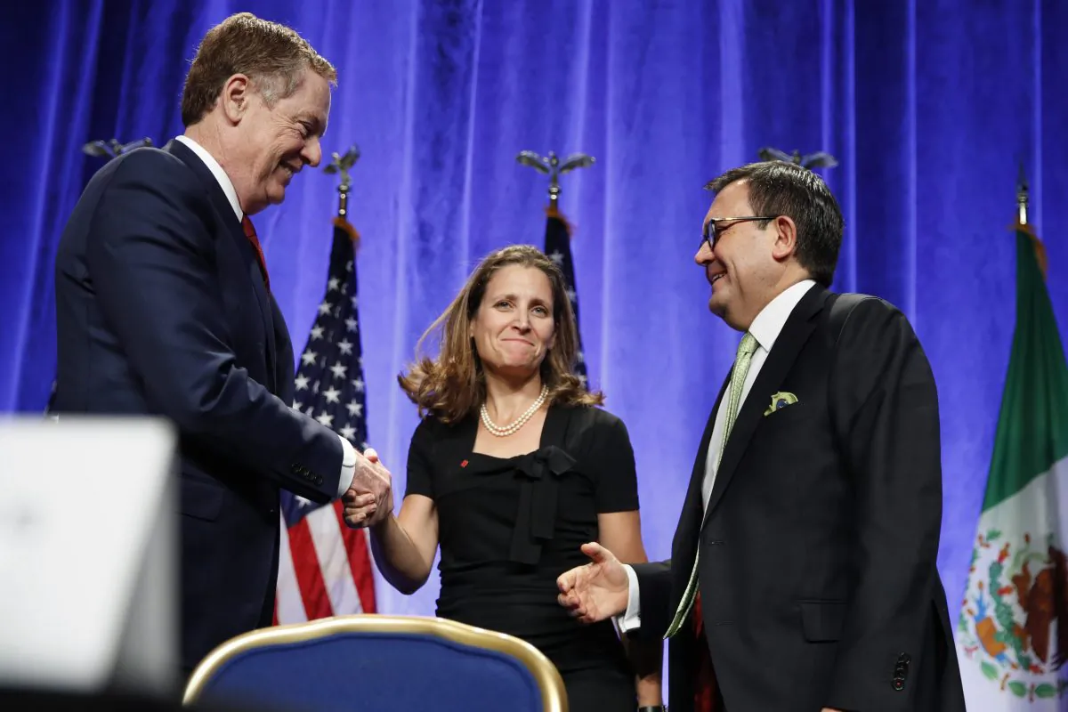 U.S. Trade Representative Robert Lighthizer (L) shakes hands with Canadian Foreign Affairs Minister Chrystia Freeland, accompanied by Mexico's Secretary of Economy Ildefonso Guajardo Villarreal, after a news conference on Aug. 16, 2017 at the start of NAFTA renegotiations in Washington, D.C. (AP Photo/Jacquelyn Martin)