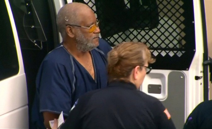 James Matthew Bradley Jr. is escorted from a prisoners van before appearing briefly in federal court, authorities found eight men dead in the back of his tractor trailer truck, in a still image from video taken in San Antonio, Texas on July 24, 2017. (Courtesy of KENS5.com/San Antonio, Texas via REUTERS)