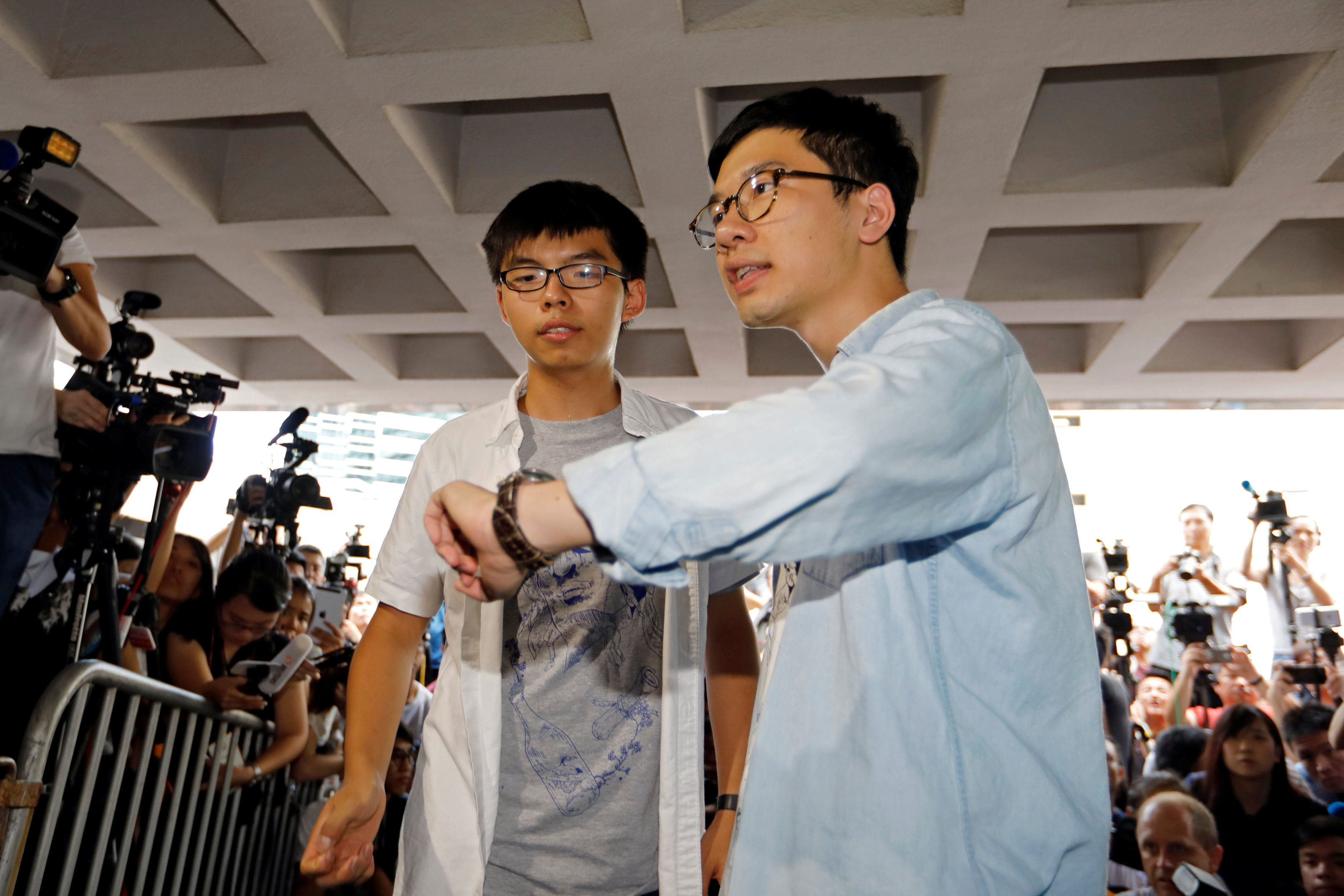 Student leaders Joshua Wong and Nathan Law arrive at the High Court to face verdict on charges relating to the 2014 pro-democracy Umbrella Movement, also known as Occupy Central protests, in Hong Kong, China on August 17, 2017. (REUTERS/Tyrone Siu)