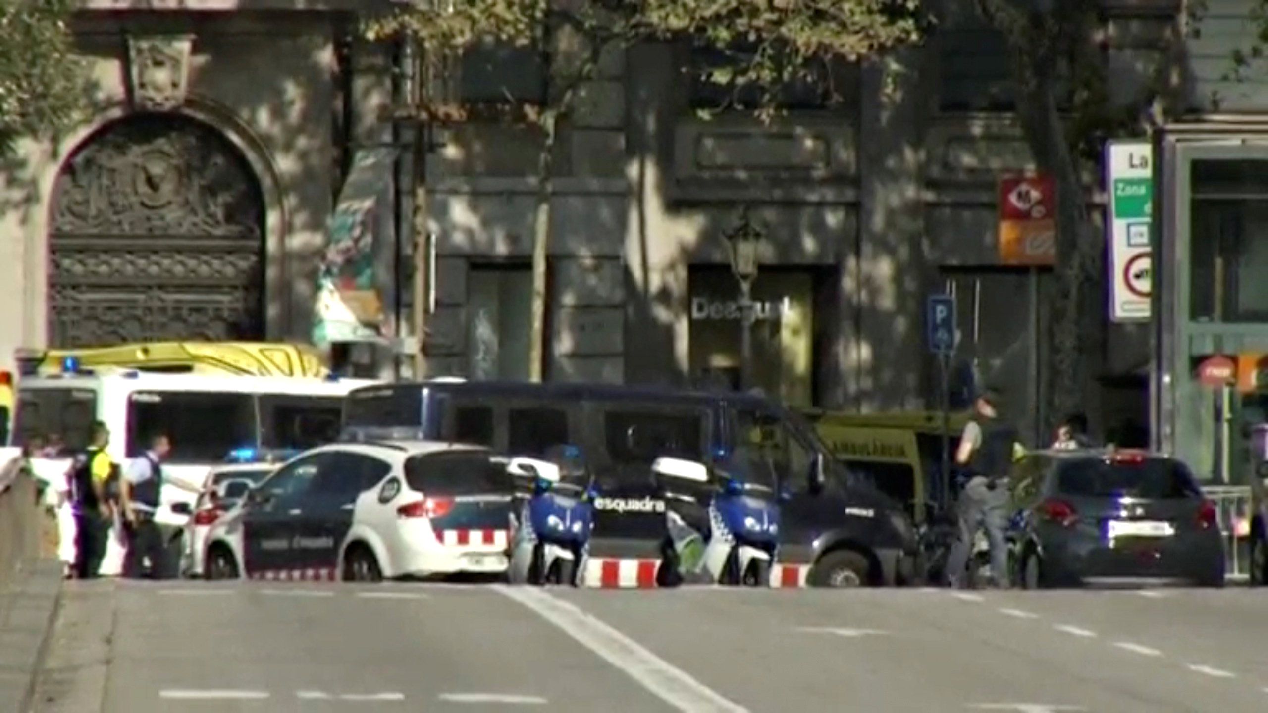 A still image from video shows a police cordon on a street in Barcelona, Spain following a van crash August 17, 2017. REUTERS TV via REUTERS