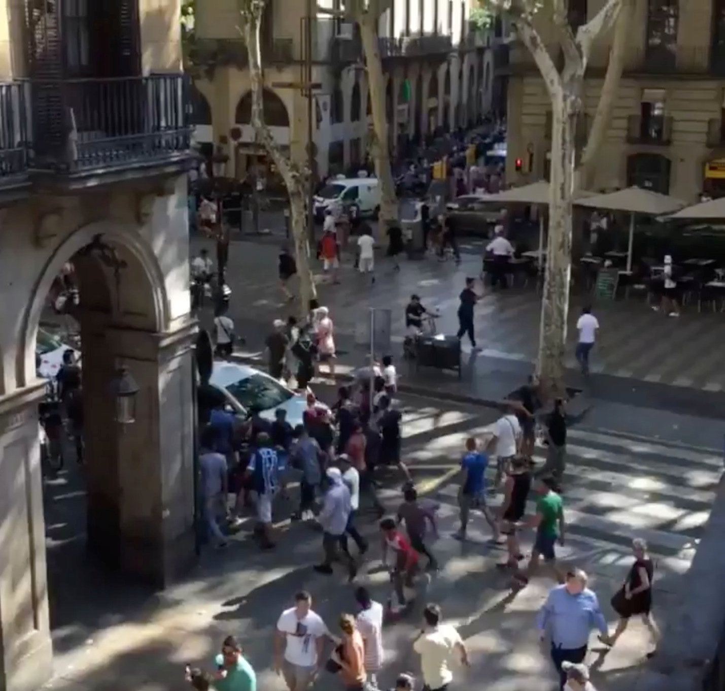 People move from the scene after a van crashed into pedestrians near the Las Ramblas avenue in central Barcelona, Spain August 17, 2017, in this still image from a video obtained from social media. Courtesy of McKenzie Tavoda/via REUTERS