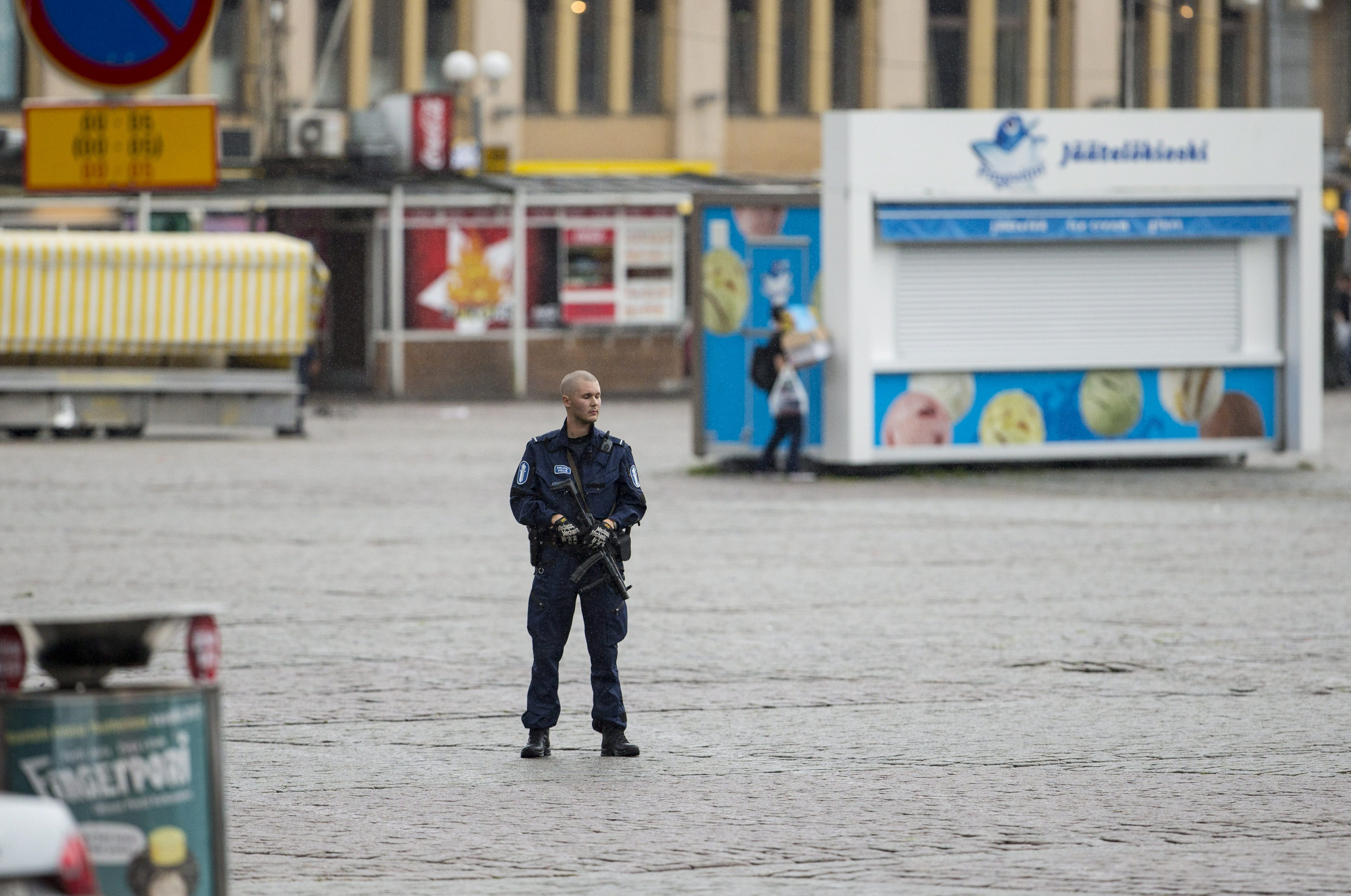 A police keeps watch at the Turku Market Square after several people were stabbed, in Finland August 18, 2017.  LEHTIKUVA/Roni Lehti via REUTERS