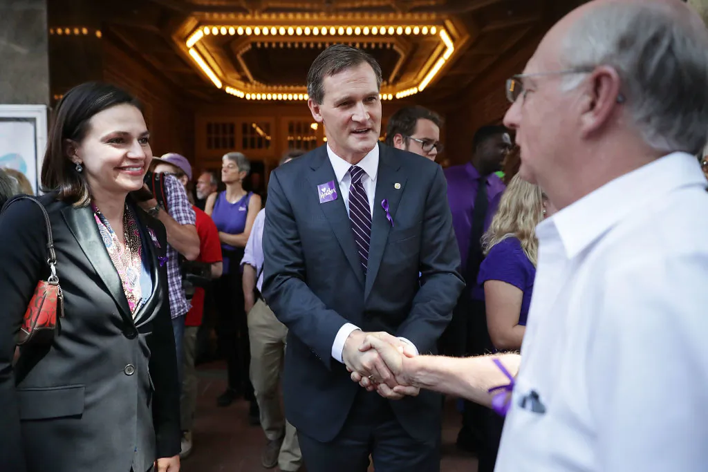 Charlottesville Mayor Mike Singer (C) and his wife Emily Blout (L) leave the Paramount Theater following a memorial service for Heather Heyer August 16, 2017 in Charlottesville, Virginia. (Chip Somodevilla/Getty Images)
