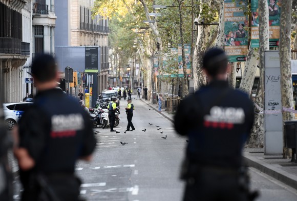 Police officers patrol on Las Ramblas following yesterday's terrorist attack, on August 18, 2017 in Barcelona, Spain. (Photo by Carl Court/Getty Images)