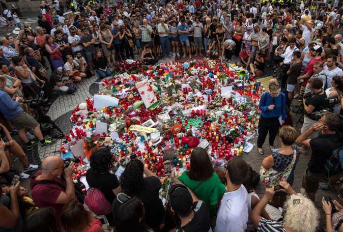People gather around tributes laid on Las Ramblas near the scene of yesterday's terrorist attack, on August 18, 2017 in Barcelona, Spain. (Carl Court/Getty Images)