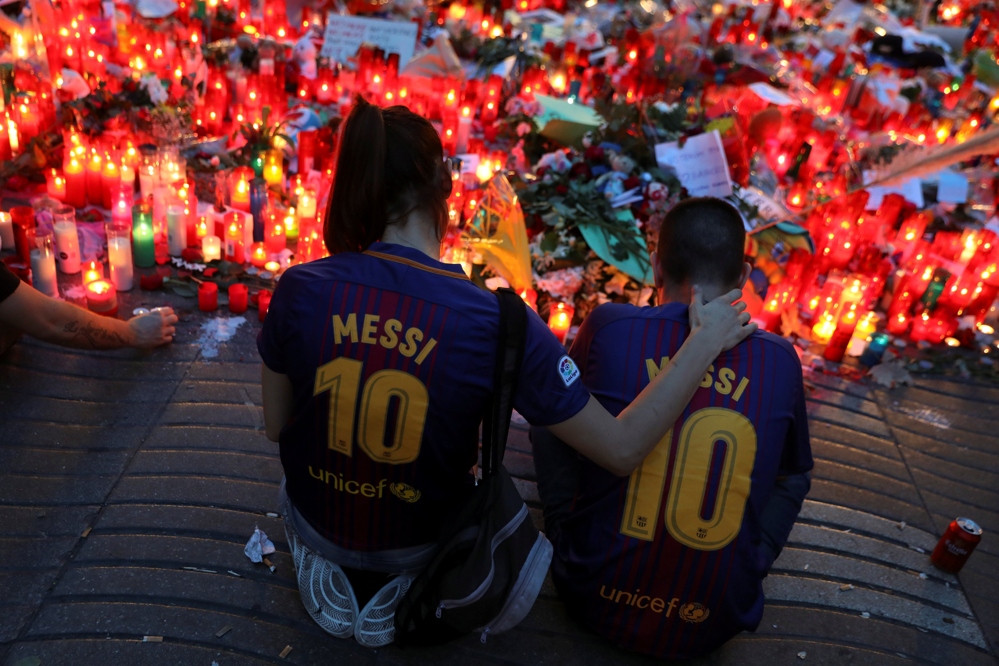 People gather at an impromptu memorial where a van crashed into pedestrians at Las Ramblas in Barcelona, Spain on August 20, 2017. (REUTERS/Susana Vera)