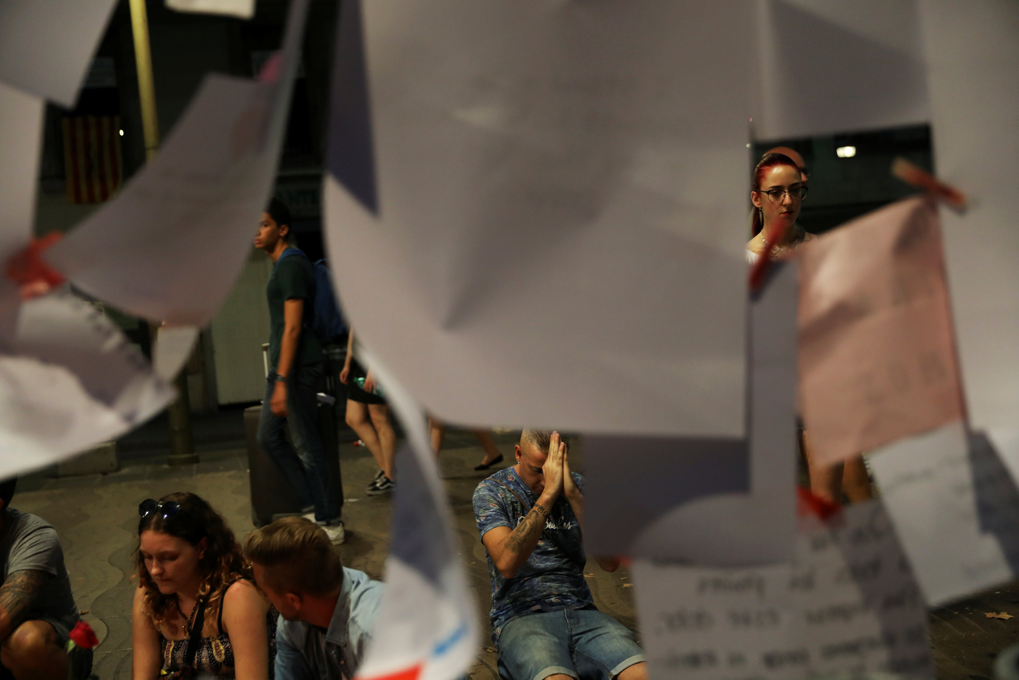 People gather at an impromptu memorial where a van crashed into pedestrians at Las Ramblas, in Barcelona, Spain on August 20, 2017. (REUTERS/Susana Vera)