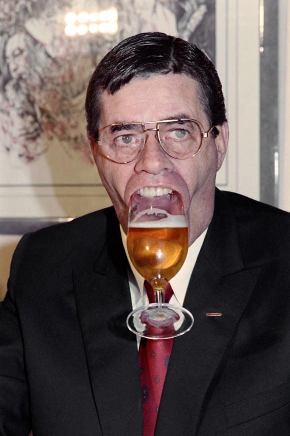 U.S. humorist, comedian, director, and singer Jerry Lewis holds a glass of beer with his mouth on Nov. 27, 1987 during a press conference in Paris.  (JEAN-LOUP GAUTREAU/AFP/Getty Images)