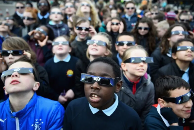 Children wear their special solar eclipse viewing glasses.
(Courtesy Mark Margolis / Rainbow Symphony)
