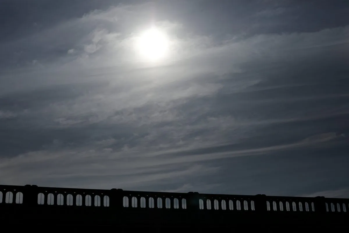 The sun emerges through clouds and fog cover before the solar eclipse in Depoe Bay, Oregon, U.S., August 21, 2017. Location coordinates for this image are 44°48'38" N 124°3'40" W. REUTERS/Mike Blake