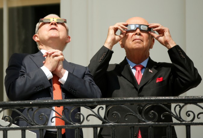 U.S. Attorney General Jeff Sessions (L) and Commerce Secretary Wilbur Ross watch the solar eclipse  from the Truman Balcony at the White House in Washington, U.S., August 21, 2017 REUTERS/Kevin Lamarque