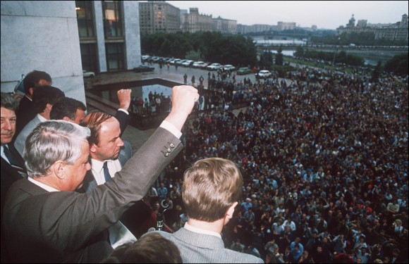 A defiant Russian President Boris Yeltsin (L) clenches a fist to his supporters from the Russian Federation building 19 August 1991 in Moscow calling on them for a general strike and to resist the pro-communist coup against Soviet President Gorbachev. (Dima Tanin/AFP/Getty Images)
