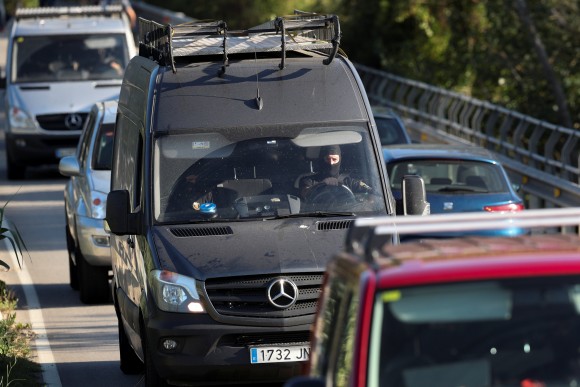 Catalan Mossos D'Esquadra officers leave the scene where Younes Abouyaaqoub, the man suspected of driving the van that killed 13 people in Barcelona last week, was killed by police in Subirats, Spain, August 21, 2017. (Reuters/Albert Gea)
