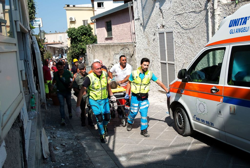 Italian emergency workers evacuate on a stretcher Mattias, a 7-year-old boy who was trapped by rubble, in Casamicciola Terme, on the Italian island of Ischia, on August 22, 2017. (ELIANO IMPERATO/AFP/Getty Images)