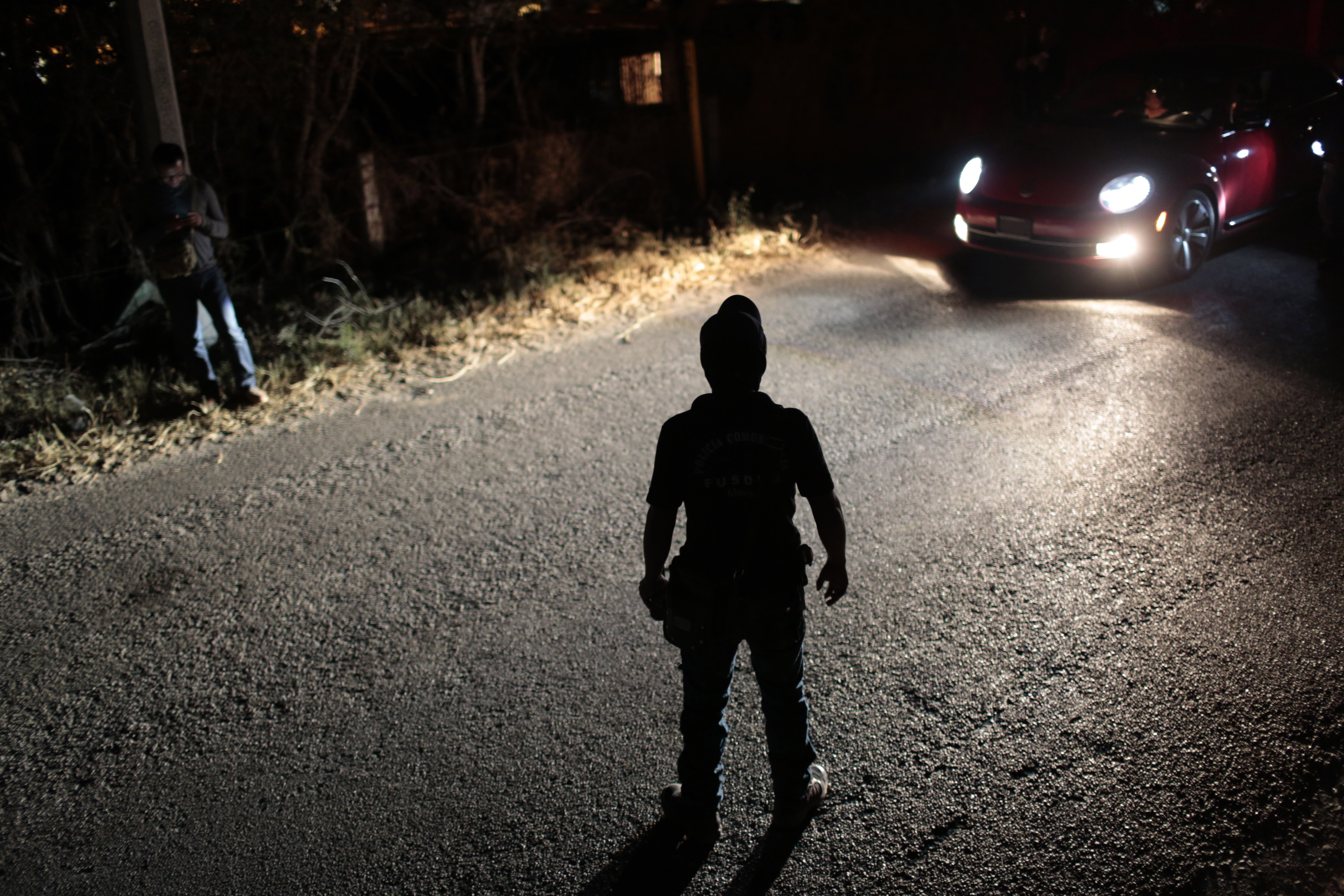 Vigilante group members of the community of Petaquillas stand guard at a checkpoint in Chilpancingo, Guerrero State, on Jan. 31, 2015. (Pedro PARDO/AFP/Getty Images)