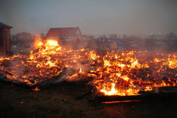 Activists and protesters set structures on fire in preparation of the Army Corp's 2pm deadline to leave the Oceti Sakowin protest camp on February 22, 2017 in Cannon Ball, North Dakota. (Stephen Yang/Getty Images)
