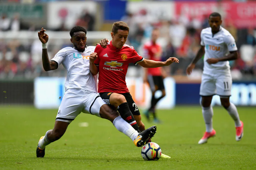 Leroy Fer of Swansea City (in white) and Ander Herrera of Manchester United battle for possession during the Premier League match between Swansea City and Manchester United at Liberty Stadium on Aug 19, 2017 in Swansea, South Wales. (Dan Mullan/Getty Images)