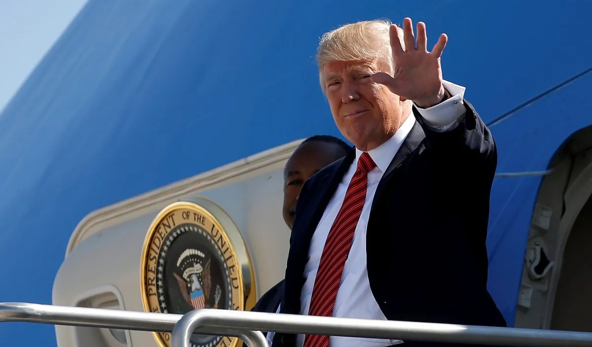 President Donald Trump waves as he steps out from Air Force One in Reno, Nevada on Aug. 23, 2017. (Joshua Roberts via Reuters)