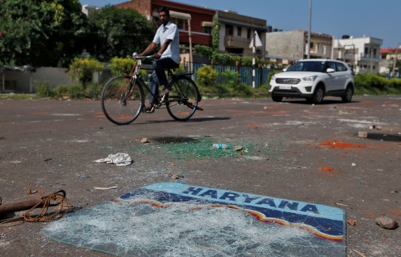 Debris are seen in the streets in Panchkula, India August 26, 2017. (Reuters/Cathal McNaughton)