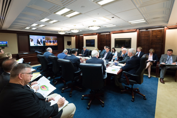 President Donald Trump is seen on screen in the White House Situation Room, as he conducts a video teleconference regarding an update on Hurricane Harvey, from a conference room at Camp David, on Aug. 26, 2017. (Official White House Photo by Andrea Hanks)