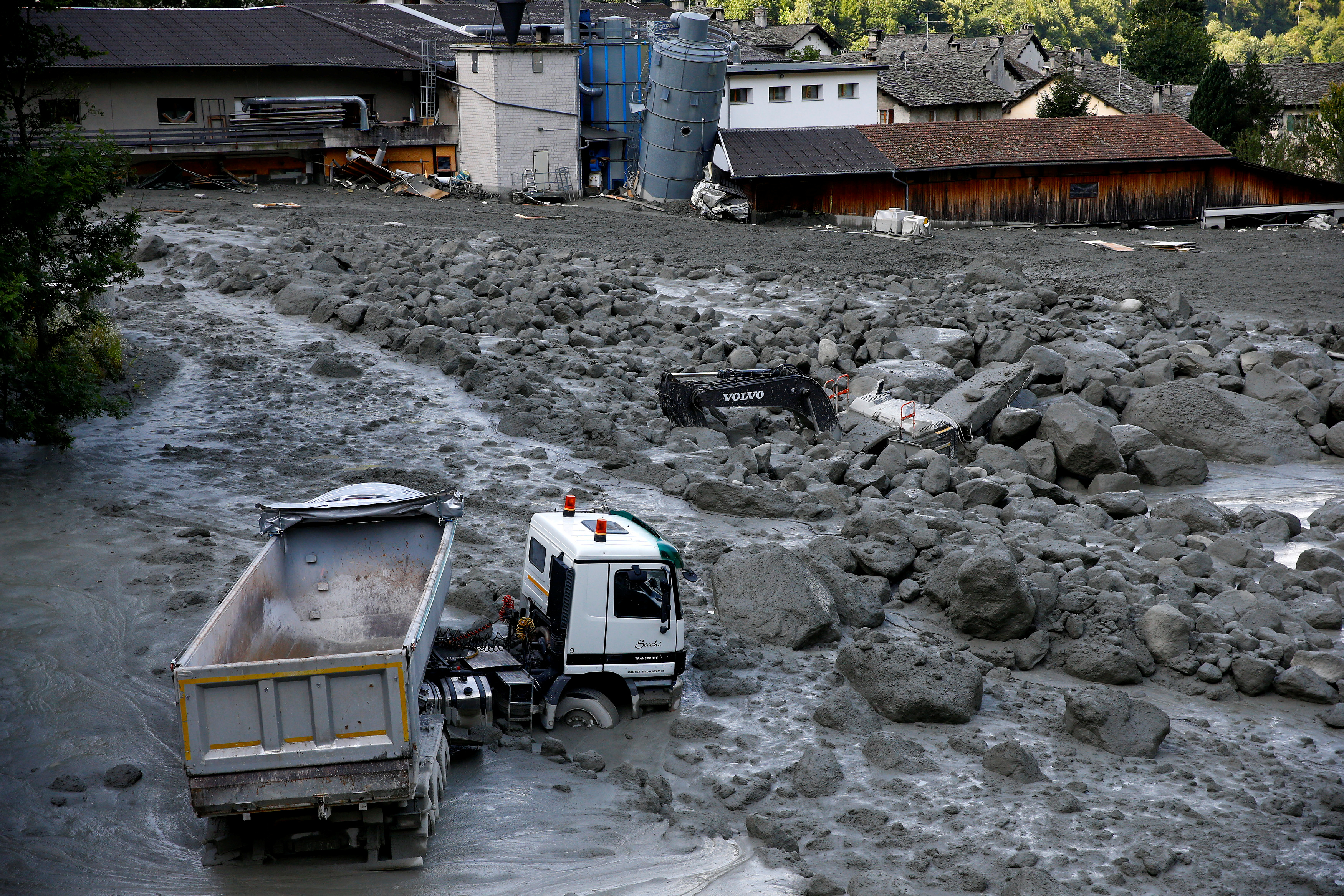 A truck sits in a landslide in the village of Bondo in Switzerland, on Aug. 26, 2017. (REUTERS/Arnd Wiegmann)