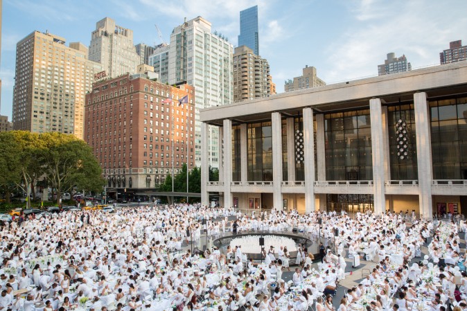 Guests attend the annual Diner en Blanc at Lincoln Center in New York on Aug. 22, 2017. Diner en Blanc began in France nearly 30 years ago. (Eric Vitale for Diner en Blanc) 