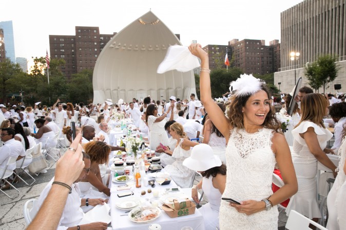 Guests attend the annual Diner en Blanc at Lincoln Center in New York on Aug. 22, 2017. Diner en Blanc began in France nearly 30 years ago and is held around the world. (Hal Horowitz for Diner en Blanc) 