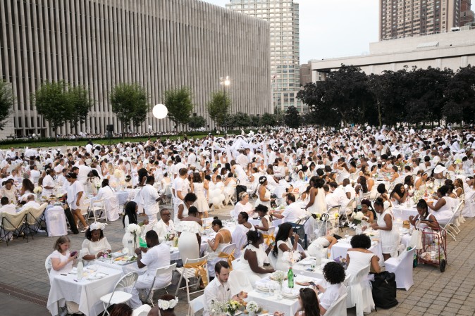 Guests attend the annual Diner en Blanc at Lincoln Center in New York on Aug. 22, 2017. Diner en Blanc began in France nearly 30 years ago and is held around the world. (Hal Horowitz for Diner en Blanc) 