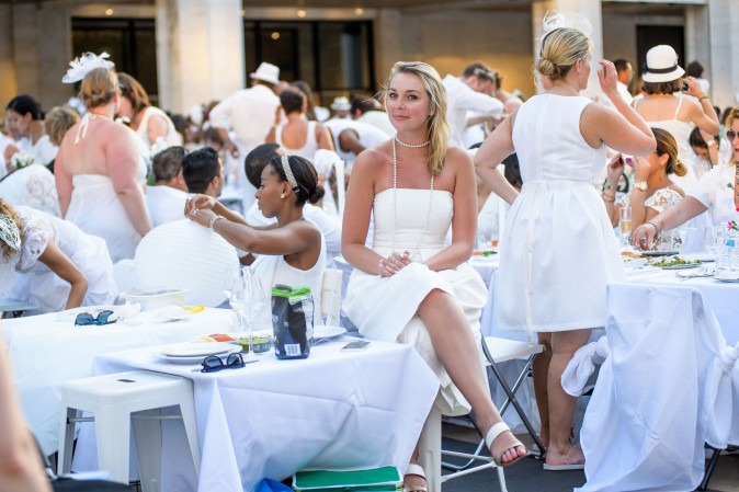 Guests attend the annual Diner en Blanc at Lincoln Center in New York on Aug. 22, 2017. Diner en Blanc began in France nearly 30 years ago and is held around the world. (Jane Kratochvil for Diner en Blank) 