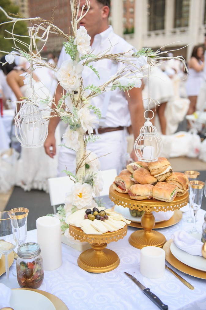 Guests attend the annual Diner en Blanc at Lincoln Center in New York on Aug. 22, 2017. Diner en Blanc began in France nearly 30 years ago and is held around the world. (Jane Kratochvil for Diner en Blank) 