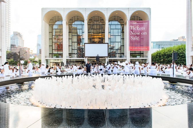 Guests attend the annual Diner en Blanc at Lincoln Center in New York on Aug. 22, 2017. Diner en Blanc began in France nearly 30 years ago and is held around the world. (Jane Kratochvil for Diner en Blank) 