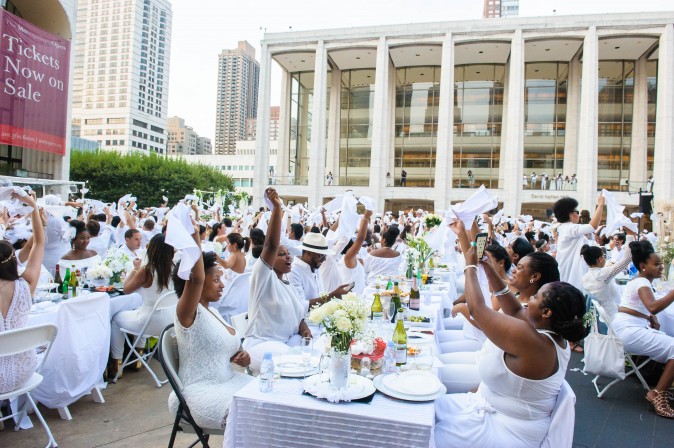 Guests attend the annual Diner en Blanc at Lincoln Center in New York on Aug. 22, 2017. Diner en Blanc began in France nearly 30 years ago and is held around the world. (Jane Kratochvil for Diner en Blank) 