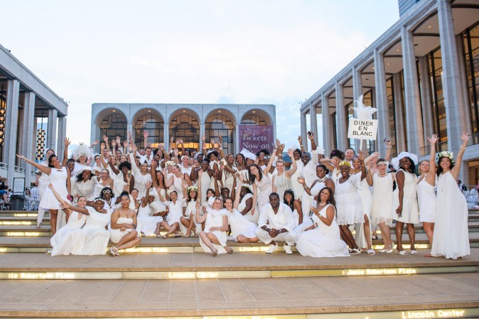 Guests attend the annual Diner en Blanc at Lincoln Center in New York on Aug. 22, 2017. Diner en Blanc began in France nearly 30 years ago and is held around the world. (Jane Kratochvil for Diner en Blank) 