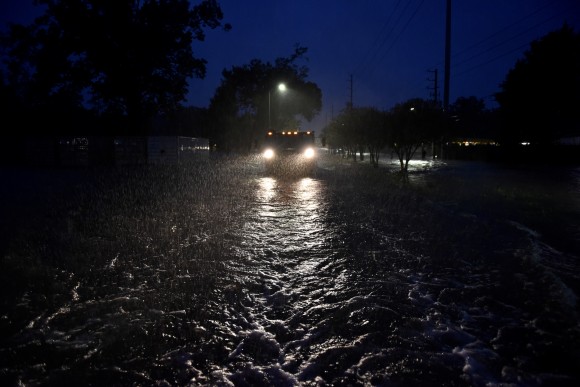 A civilian owned military vehicle drives through floodwaters performing search and rescue after Hurricane Harvey inundated the Texas Gulf coast with rain causing widespread flooding, in Houston, Texas, U.S. August 28, 2017. (Reuters/Nick Oxford)